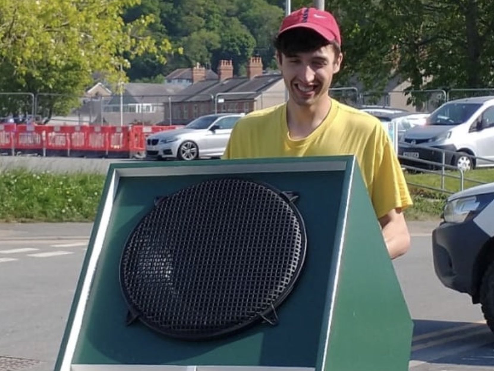 Max carrying a soundsystem scoop bin