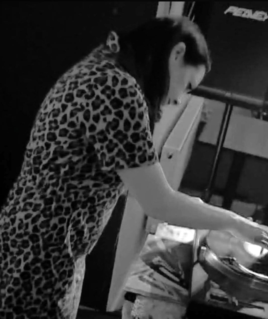 Miss Morgan cueing a record on the decks